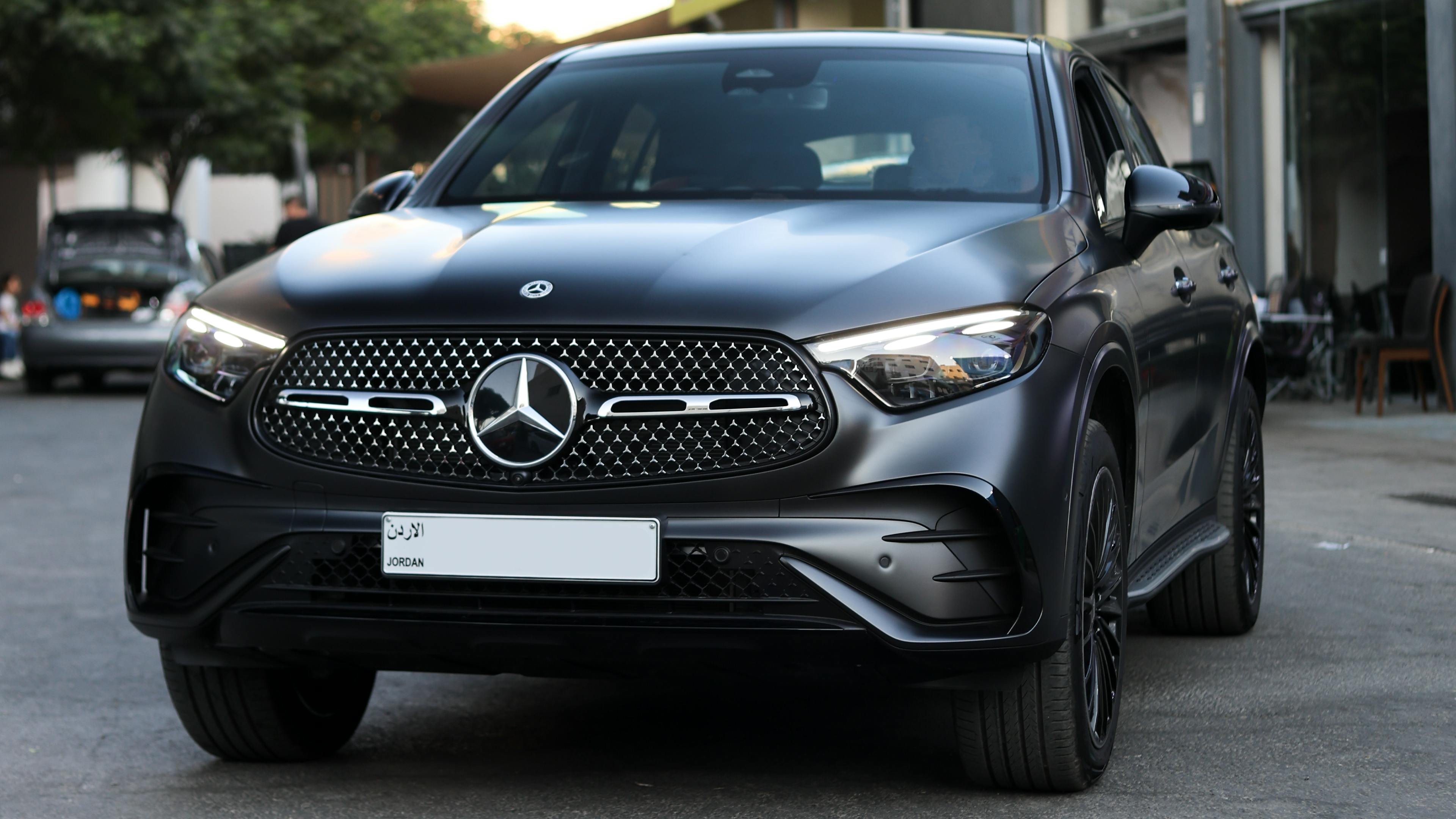 Sleek matte black Mercedes SUV parked in Amman, highlighting luxury design.